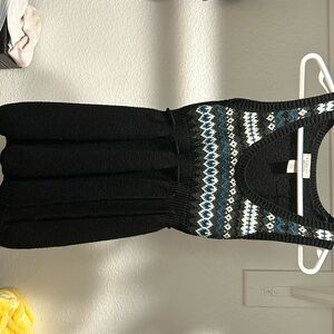 Sweater vest with cinched waist tie